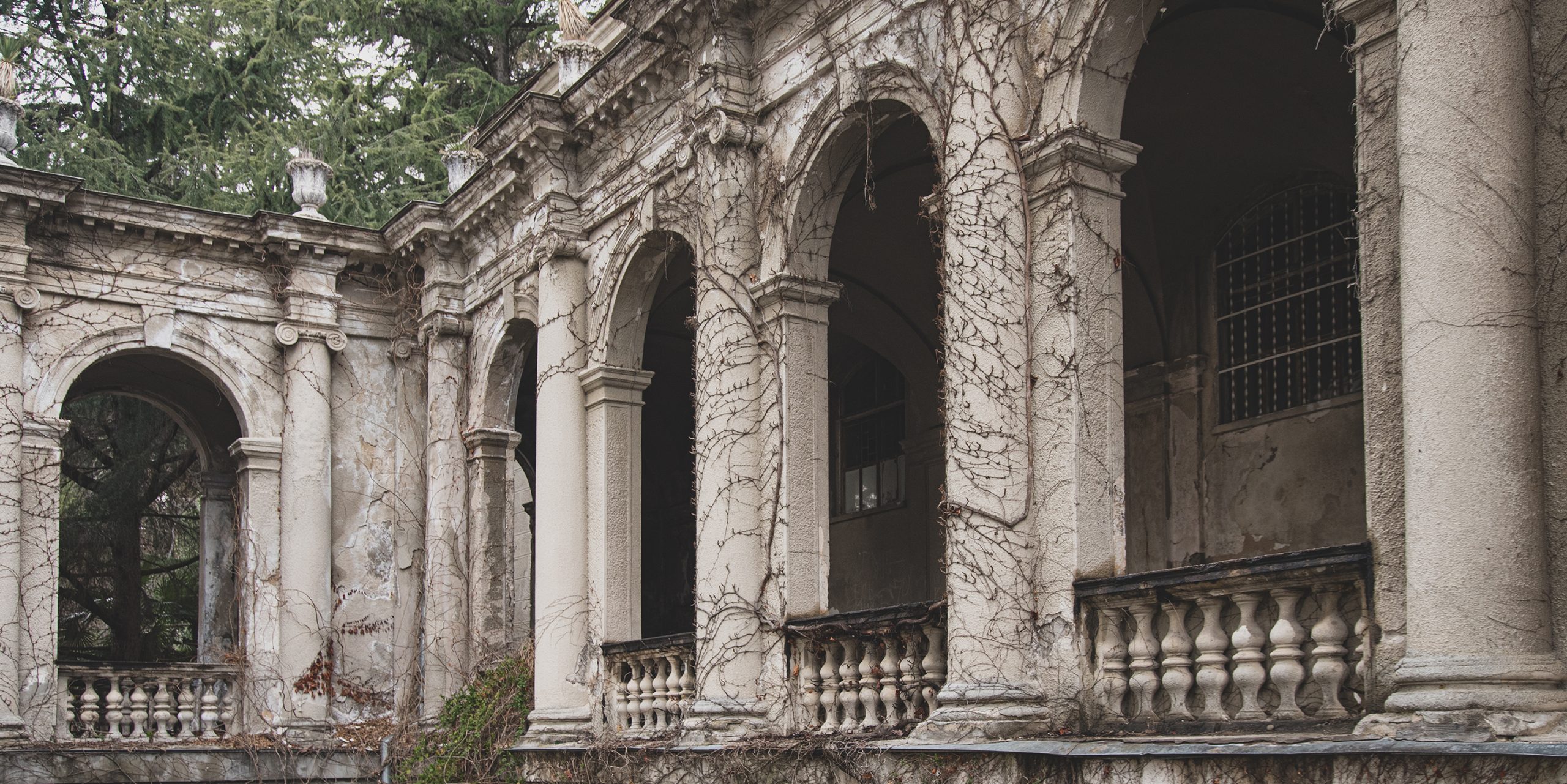 gray and gloomy abandoned sanatorium Ordzhonikidze in Sochi on cloudy day, Krasnodar Krai